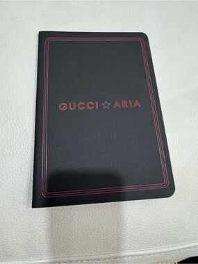 Gucci ⭐️ Aria Black notebook with red and purple detail.